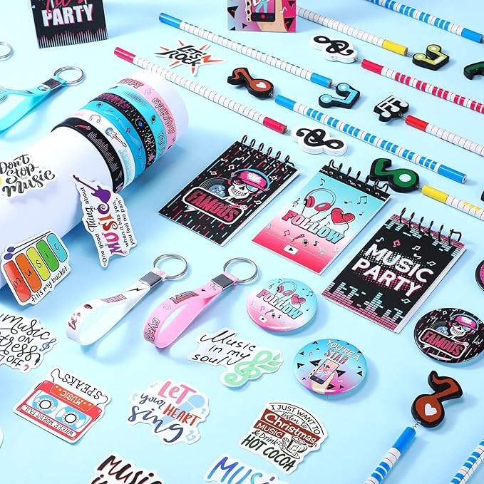 Jexine 128 Pcs Music Theme Party Supplies Include 12 Silicone Bracelets, 12 Keychains, 12 Badges, 12 Pencils, 12 Drawstring Bag, 18 Spiral Notepads, 50 Musical Stickers for Kids Birthday Party (Music)